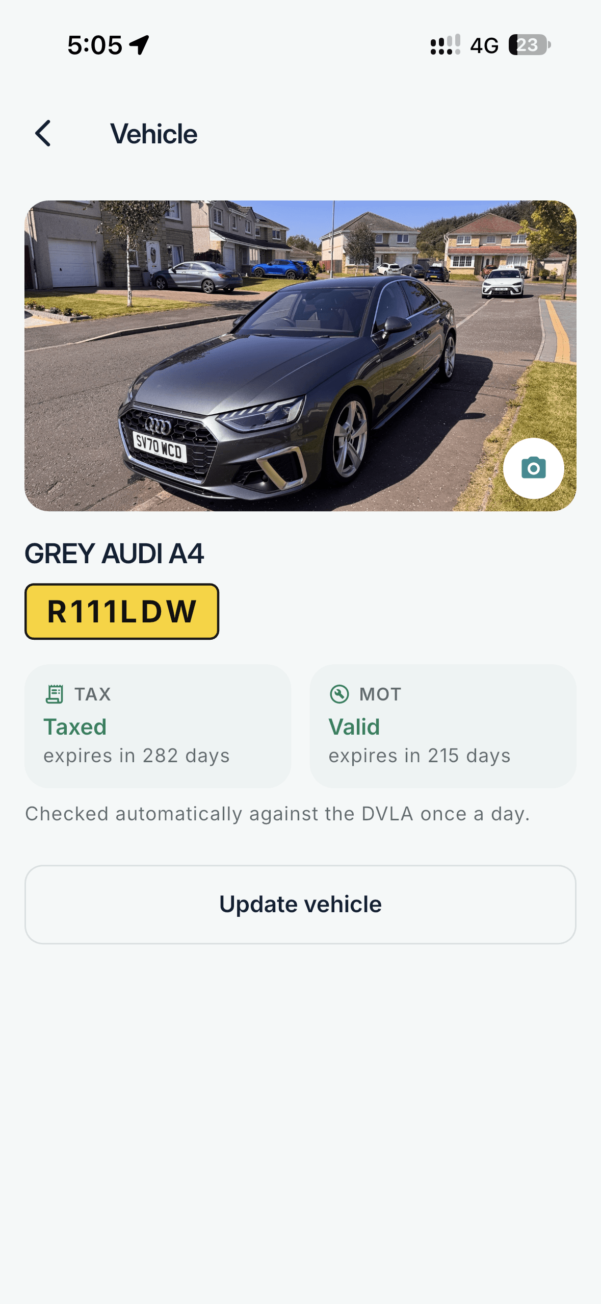 Vehicle screen with a photo of the car, its registration, and tax and MOT status checked against the DVLA